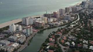 AX0021_033 - 5K aerial stock footage of beachfront hotels and condominiums in Miami Beach, Florida
