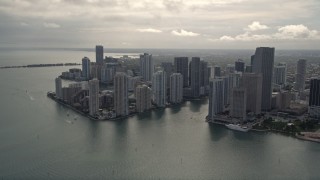 AX0021_078E - 5K aerial stock footage tilt from Port of Miami to reveal and approach Downtown Miami, Florida