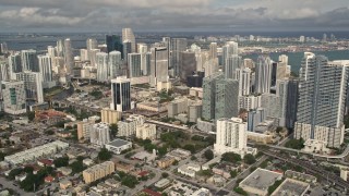 AX0021_085E - 5K aerial stock footage of skyscrapers in the coastal city of Downtown Miami, Florida