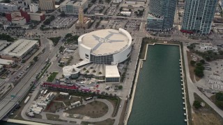 AX0021_095 - Aerial stock footage of 5K aerial  video orbit of American Airlines Arena on the waterfront of Downtown Miami, Florida