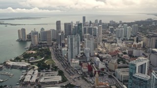 AX0021_096E - 5K aerial stock footage pan from four skyscrapers to reveal and approach Downtown Miami high-rises, Florida