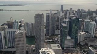 AX0021_099E - 5K aerial stock footage fly over Bayfront Park to approach Southeast Financial Center in Downtown Miami, Florida