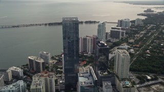 AX0021_104E - 5K aerial stock footage fly over bayfront skyscrapers to approach Four Seasons Hotel in Downtown Miami, Florida