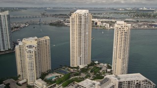 AX0021_122 - 5K aerial stock footage of waterfront skyscrapers on the shore of Brickell Key, Downtown Miami, Florida