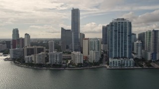AX0021_123E - 5K aerial stock footage of bayfront skyscrapers on the shore of Downtown Miami, Florida