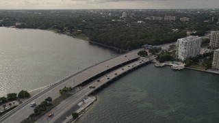 AX0021_127 - 5K aerial stock footage of flying by the Rickenbacker Causeway to the mainland in Miami, Florida
