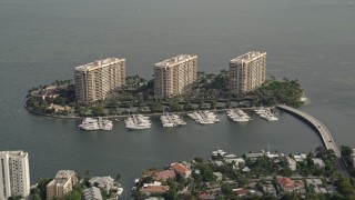 AX0021_146 - 5K aerial stock footage of a trio of condominium complexes on Grove Isle in Miami, Florida