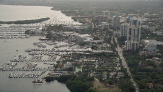 AX0021_147E - 5K aerial stock footage approach Dinner Key Marina in Coconut Grove, Florida