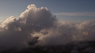 AX0022_017 - 5K stock footage aerial video flyby a cloud formation at sunset over Miami, Florida