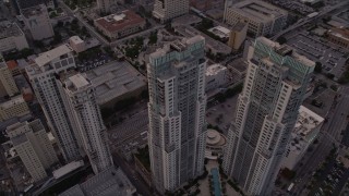 AX0022_033E - 5K aerial stock footage of the Vizcayne towers in Downtown Miami at sunset, Florida