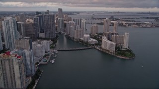 AX0022_044E - 5K aerial stock footage approach the bridge linking Downtown Miami with Brickell Key at sunset, Florida