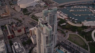 AX0022_048E - 5K aerial stock footage approach the modern towers of Vizcayne in Downtown Miami at sunset, Florida