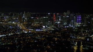 AX0023_006 - 5K aerial stock footage approach the Downtown Miami skyline at night, Florida