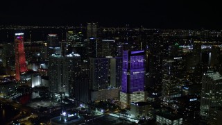 AX0023_008E - 5K aerial stock footage approach Brickell World Plaza at night in Downtown Miami, Florida