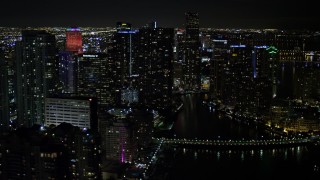 AX0023_035 - 5K aerial stock footage of Brickell Key and Downtown Miami skyscrapers at nighttime, Florida