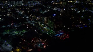 AX0023_069 - 5K aerial stock footage of beachfront park and hotel at night in South Beach, Florida