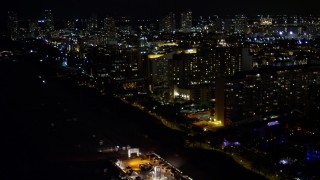 AX0023_106E - 5K aerial stock footage flyby beachfront hotels at night in Miami Beach, Florida