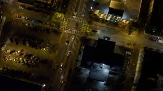 AX0023_117 - 5K aerial stock footage bird's eye view of a street through South Beach at night, Florida