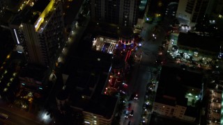 AX0023_118E - 5K aerial stock footage of Bancroft Hotel at night in South Beach, Florida