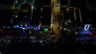 AX0023_123E - 5K aerial stock footage of Ocean Drive hotels at night in South Beach, Florida