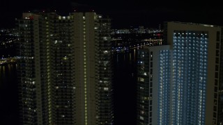AX0023_144 - 5K aerial stock footage flyby 900 Biscayne Bay and MarinaBlue at night in Downtown Miami, Florida