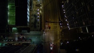 AX0023_164E - 5K aerial stock footage of bird's eye view of Brickell Avenue through Downtown Miami at night, Florida