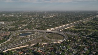 AX0024_001 - 5K aerial stock footage of flying by the Highway 874 and 990 interchange, Kendall, Florida