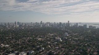 AX0024_025E - 5K aerial stock footage fly over neighborhoods, reveal Downtown Miami skyline, Coconut Grove, Florida