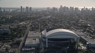 AX0024_033 - 5K aerial stock footage tilt from Marlins Park revealing Downtown Miami skyline, Florida
