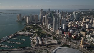 AX0024_039E - 5K aerial stock footage of American Airlines Arena, Bayfront Park, and skyscrapers in Downtown Miami, Florida