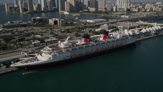 AX0024_064 - 5K stock footage aerial video of orbiting Disney Cruise Ship docked at Port of Miami, Miami, Florida