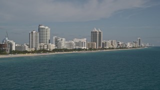 AX0024_082E - 5K aerial stock footage of flying by hotels along the shore, Miami Beach, Florida