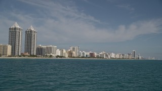 AX0024_085 - 5K aerial stock footage of flying by the Blue and Green Diamonds, hotels, apartments, Miami Beach, Florida