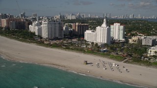 AX0024_090E - 5K aerial stock footage of flying by hotels and condo complexes, Miami Beach, Florida