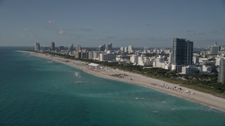 AX0024_092 - 5K aerial stock footage of flying by hotels by the beach, South Beach, Miami Beach, Florida