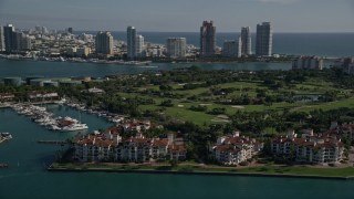 AX0024_100 - 5K aerial stock footage of flying by Fisher Island Golf Course, Fisher Island, Florida