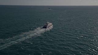 AX0024_104 - 5K aerial stock footage of tracking a yacht, Atlantic Ocean, Miami, Florida