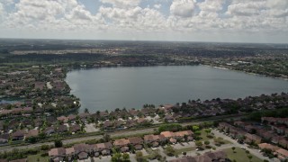 AX0025_001 - 5K aerial stock footage video of flying over homes in Three Lakes, Miami, Florida