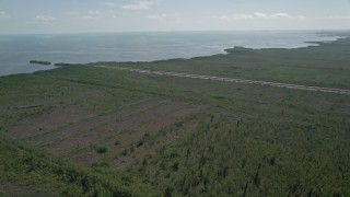 AX0025_011 - 5K aerial stock footage of flying over Mangrove Preserve, revealing canal and coastline, Homestead, Florida