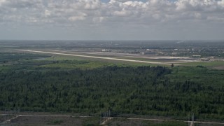 AX0025_014 - 5K aerial stock footage of flying by Homestead Base, Homestead, Florida