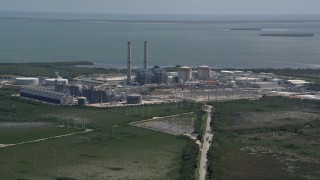 AX0025_021 - 5K aerial stock footage of flying by Turkey Point Power Plant, Homestead, Florida