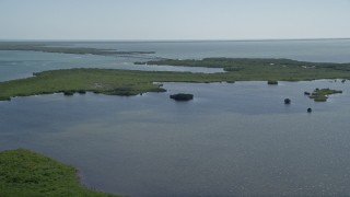 AX0025_032 - 5K aerial stock footage of flying over a lagoon with Card Sound Bridge in the distance, Homestead, Florida