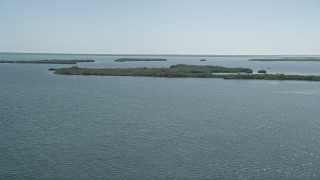 AX0025_043 - 5K aerial stock footage of flying by coastal mangroves, Model Lands Basin, Homestead, Florida