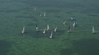 AX0025_067E - 5K aerial stock footage of sailboats on Buttonwood Sound, Key Largo, Florida