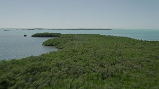 AX0025_073E - 5K aerial stock footage of approaching mangroves off the shore, Key Largo, Florida