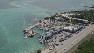 AX0025_109 - 5K aerial stock footage of Whale Harbor Restaurant and Marina, Chesapeake Beach Resort, Islamorada, Florida