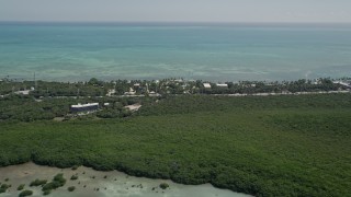 AX0025_117 - 5K aerial stock footage of flying by Resorts and Marinas along the shore, Islamorada, Florida