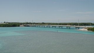 AX0025_123 - 5K aerial stock footage of flying by a bridge on the Overseas Highway, Islamorada, Florida