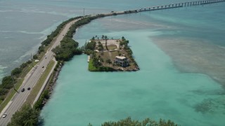 AX0025_134 - 5K aerial stock footage of approaching an oceanfront home on Craig Key, Florida