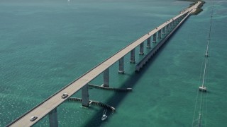 AX0025_135E - 5K stock footage aerial video of approaching Overseas Highway bridge to Fiesta Key, Florida